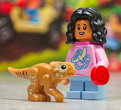 girl minifigure with baby dinosaur